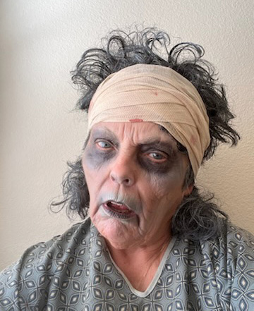 Pat demonstrating heavy makeup before using Zombie Resurrection Make-Up Remover